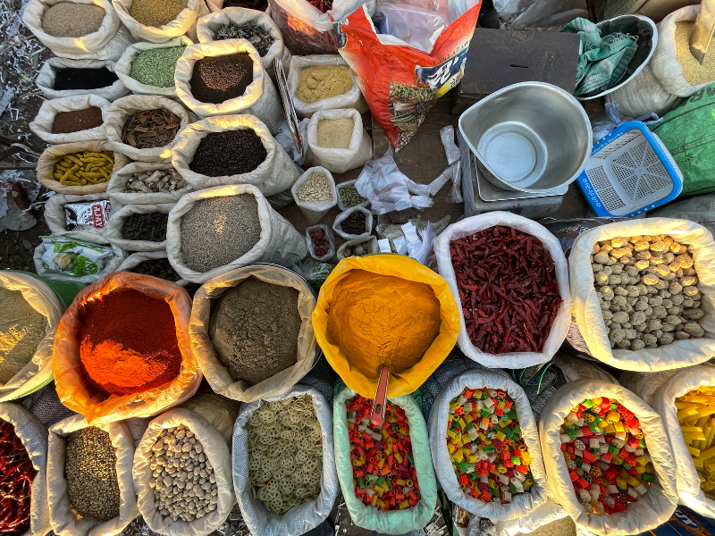 many different types of organic bulk herbs are displayed on the ground